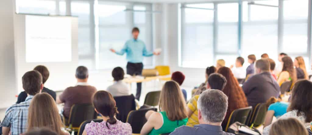 Speaker Giving a Talk at Business Meeting.